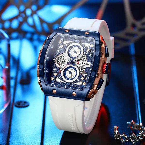 Luxury watch with intricate design on a white strap against a blue abstract background