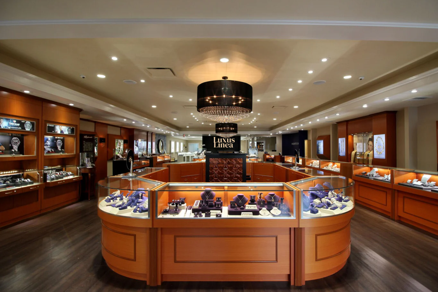 Luxury store interior with display cases and branded name signs.